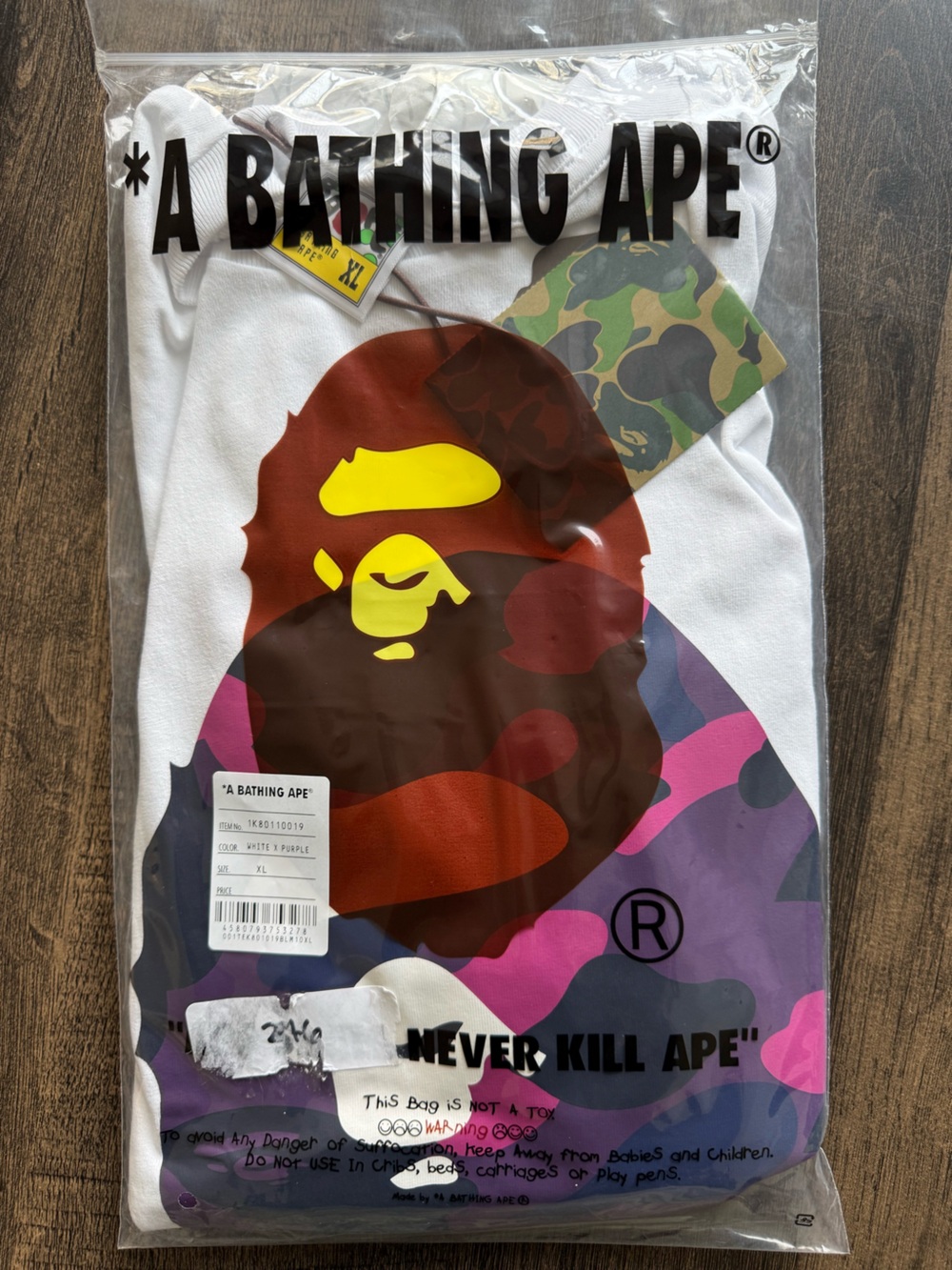 A Bathing Ape White Tee with Multicolor Camo Ape Head